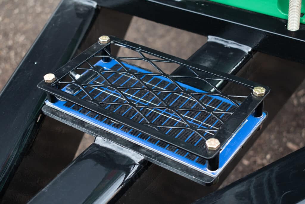 Footrest tray installation for Mulch Mule Contractor convenience and efficiency.