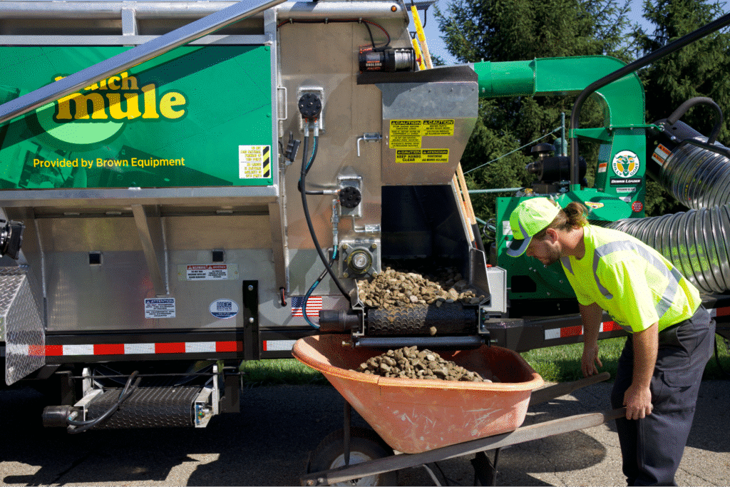 Multigenerational Landscaping Business worker using the Mulch Mule