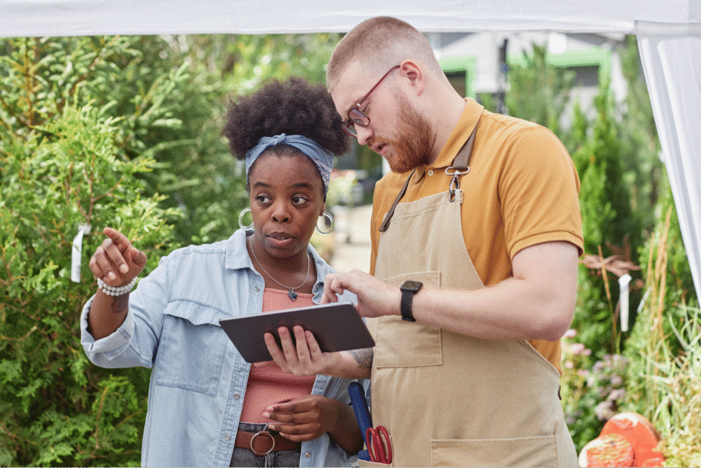 Landscaping business manager with garden center representative.
