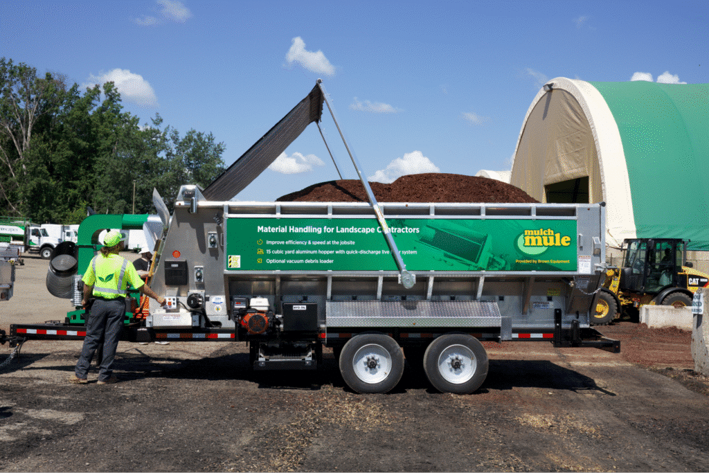 bulk handling system efficiently transferring mulch at a construction site.