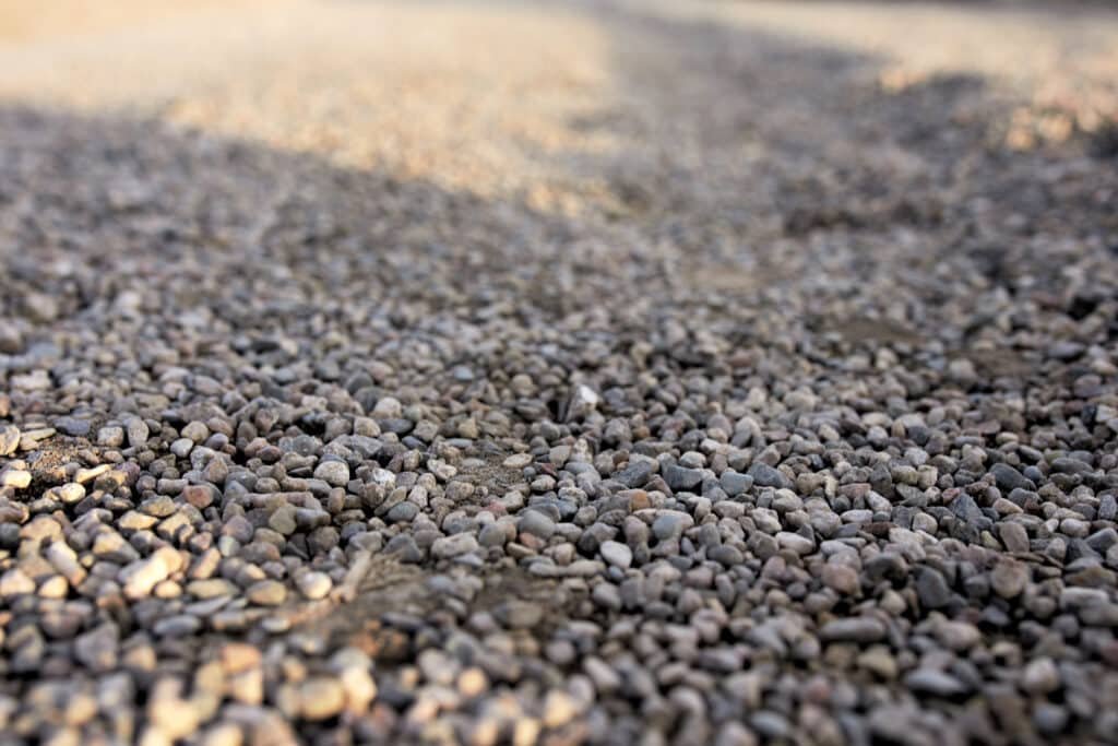 Blurred stone texture background with gravel for design and landscaping applications.