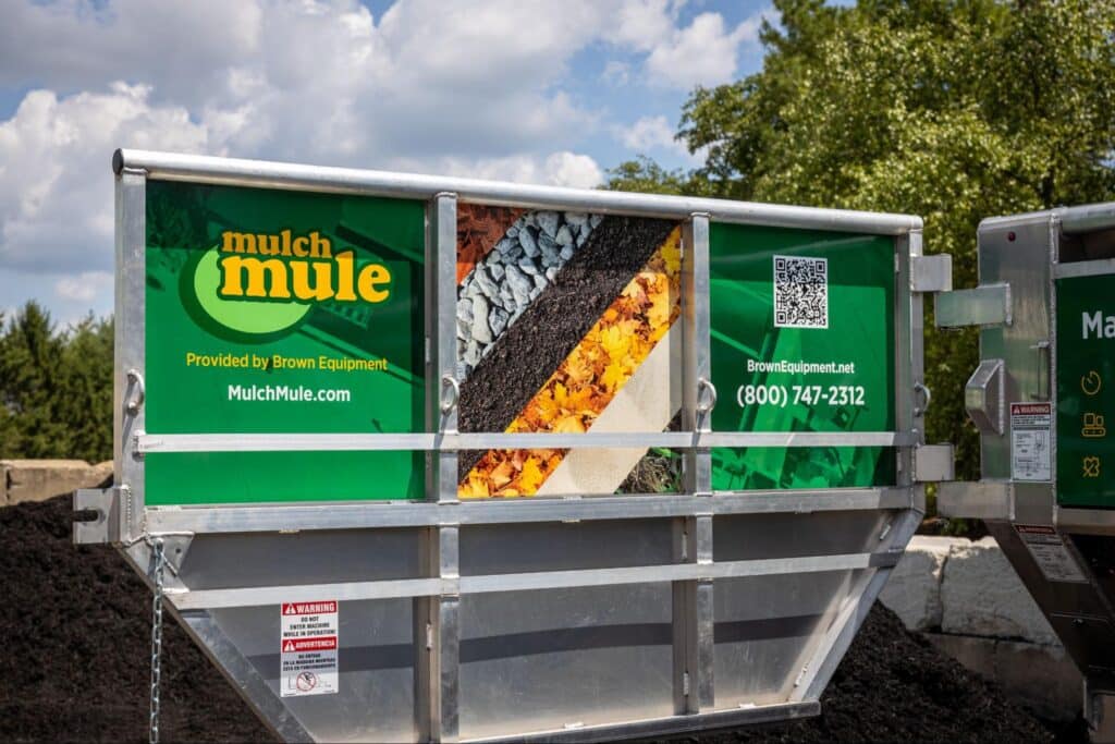 Mulch Mule mulch cart showcasing various mulch types and contact information.