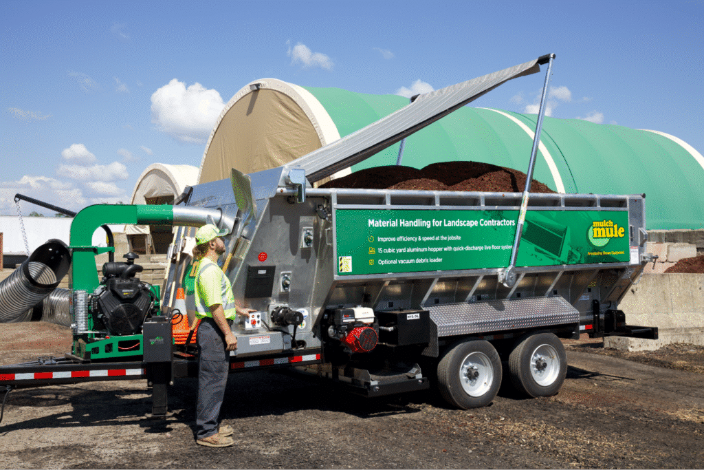 Efficient landscape automated mulch equipment with a specialized trailer and equipment.