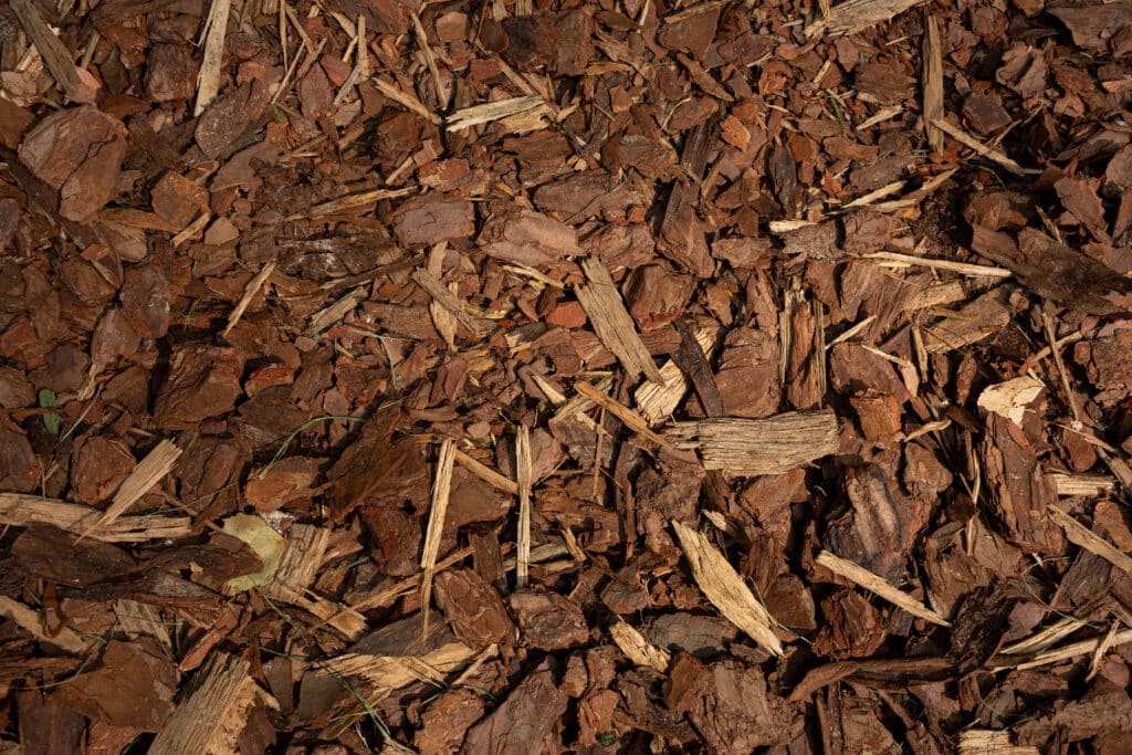 Natural wood mulch texture perfect for landscaping and gardening projects.