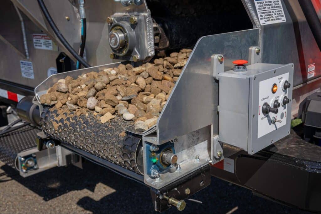 Efficient mulch conveyor system for streamlined material handling and transfer.