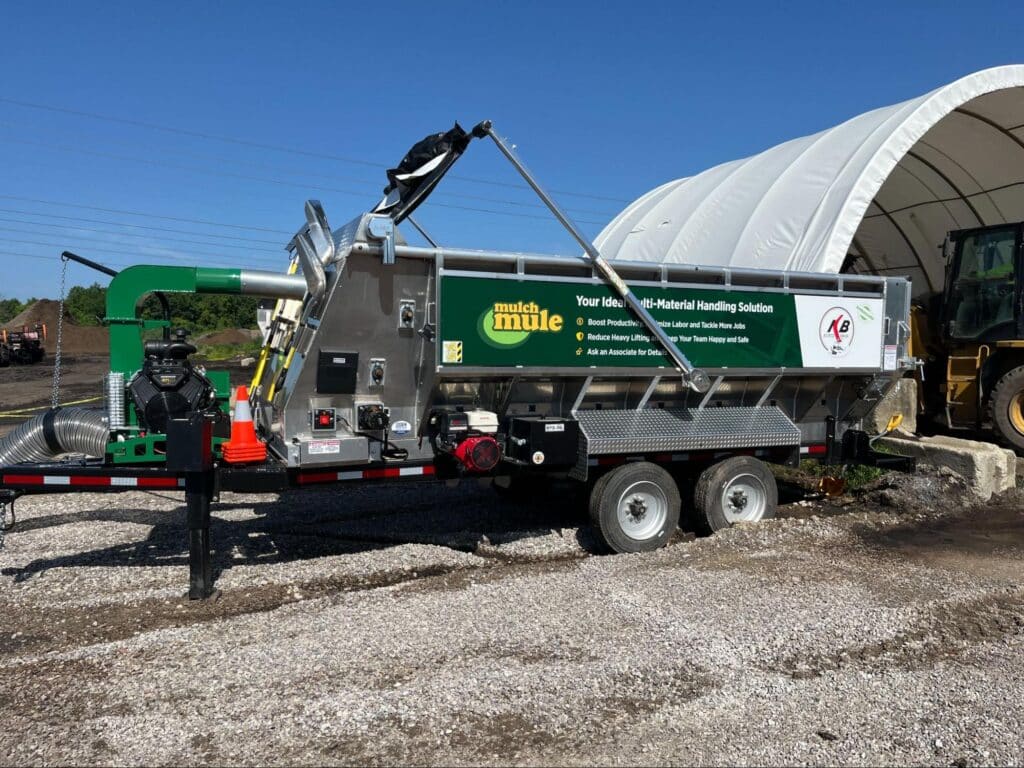 Efficient Mulch Mule trailer optimizing landscaping and agricultural tasks in sunny conditions.