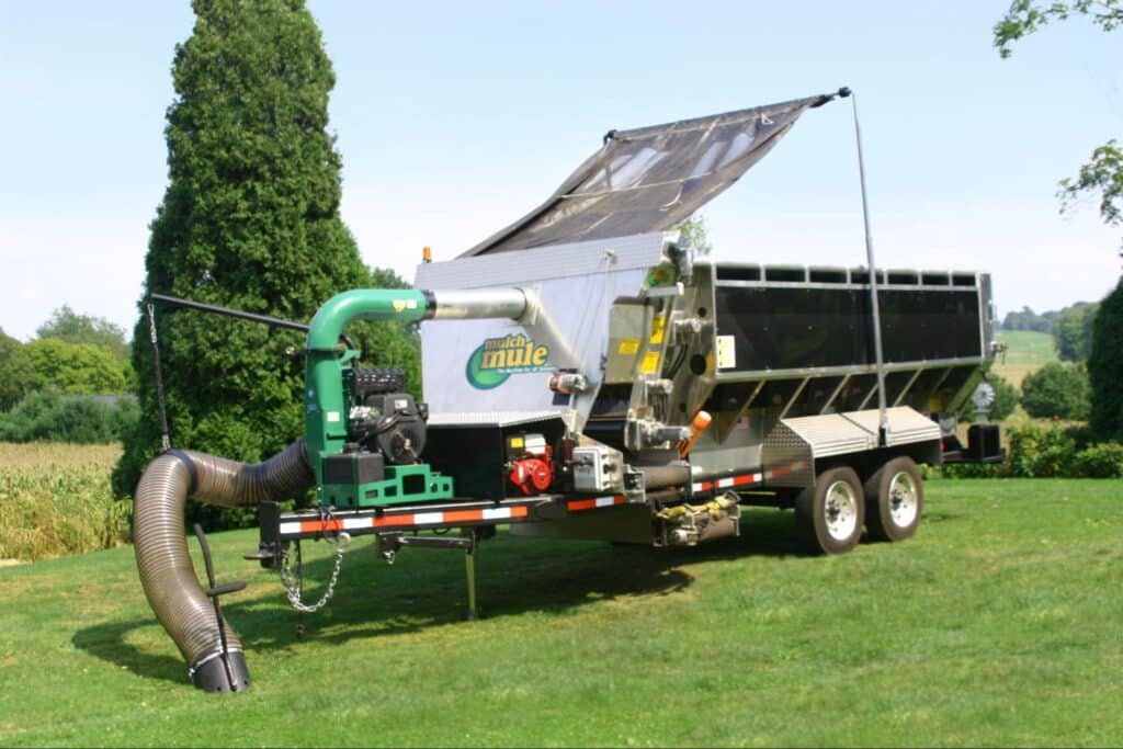 Mulch Mule trailer parked in a landscaped garden, ready for delivery.