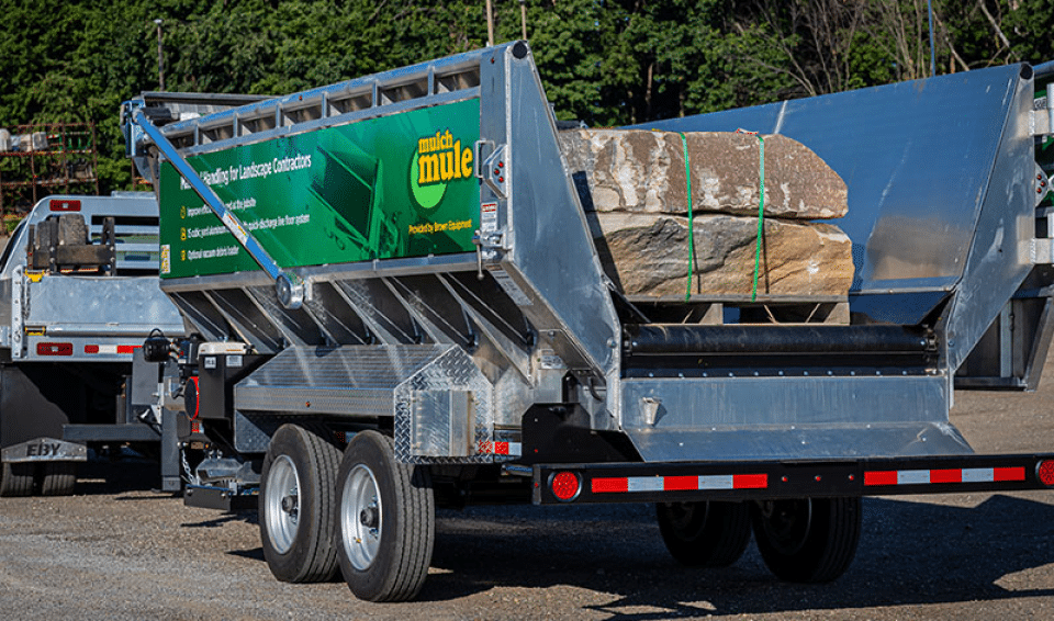 Mulch Mule trailer transporting palletized stones for landscaping and gardening projects.