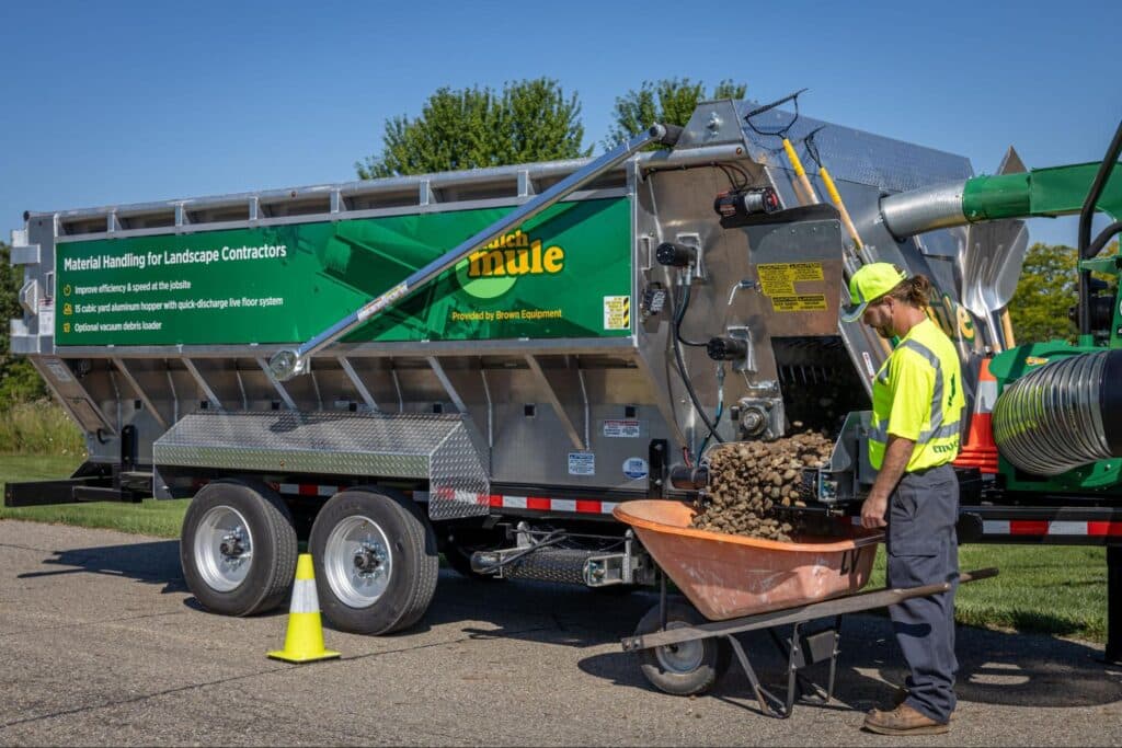 Efficient yard waste collection truck managing landscaping debris.